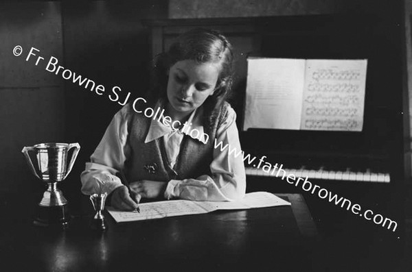 JONES FAMILY AT 7 AILESBURY ROAD BETTY STUDYING MUSIC